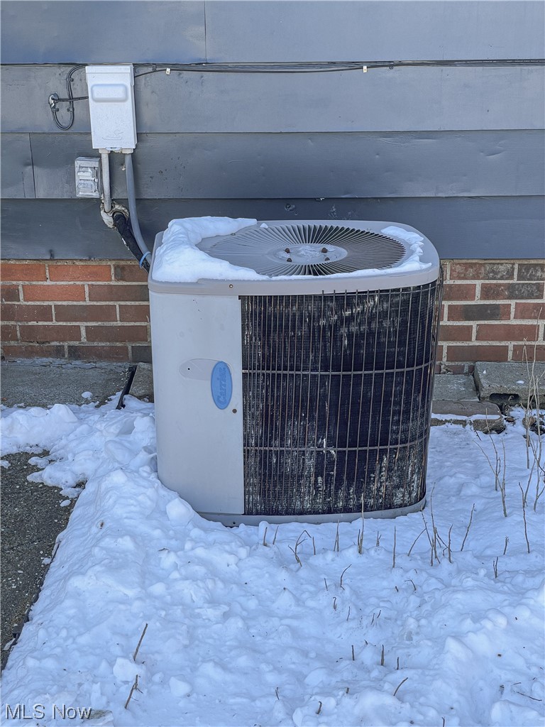 24709 Emery Road Warrensville Heights, OH 44128 - Photo 4 of 34 Exterior details featuring central air condition unit