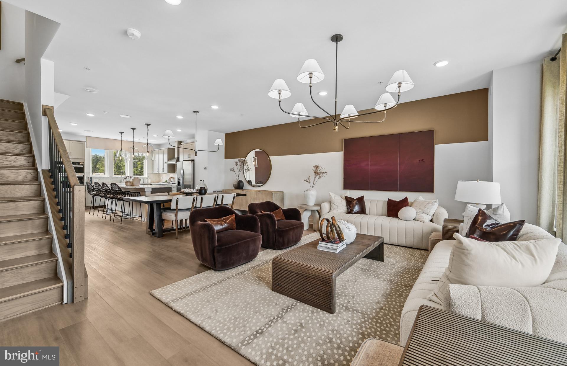 712 Shellbark Lane Laurel, MD 20724 - Photo 12 of 57 a living room with furniture kitchen view and a chandelier