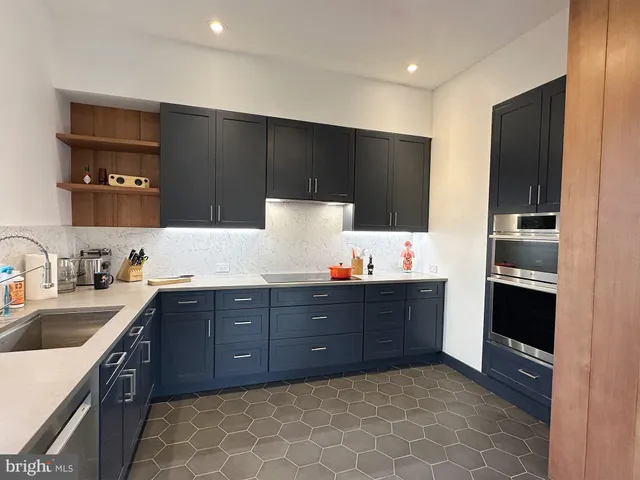 a kitchen with a sink and cabinets