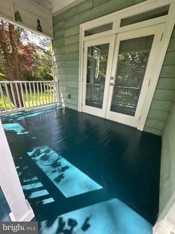 a view of swimming pool from a balcony