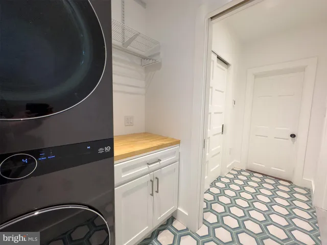 a view of a hallway with washer and dryer
