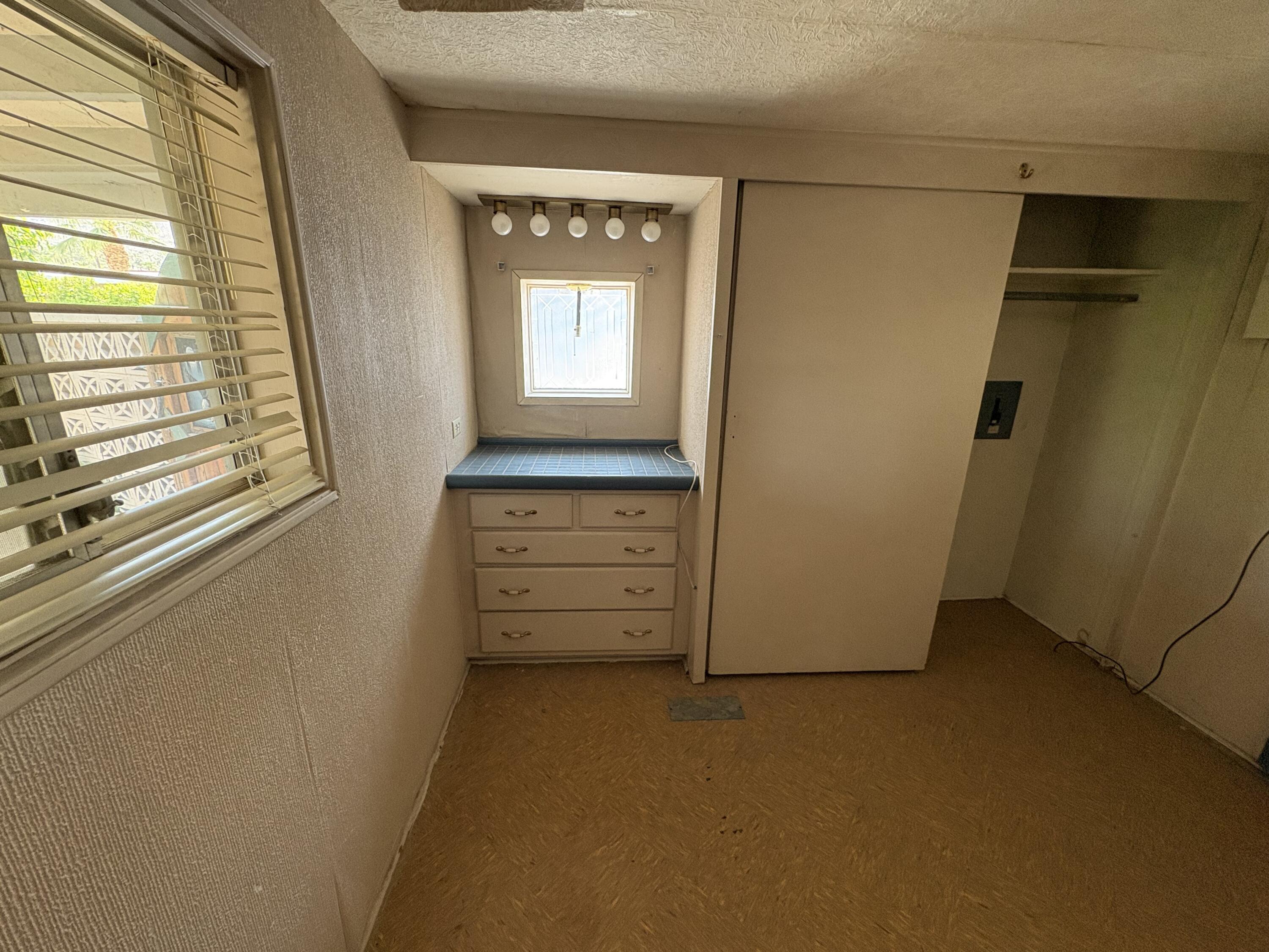 70260 Highway 111, Unit 148 Rancho Mirage, CA 92270 - Photo 19 of 36 a view of an empty room and a window