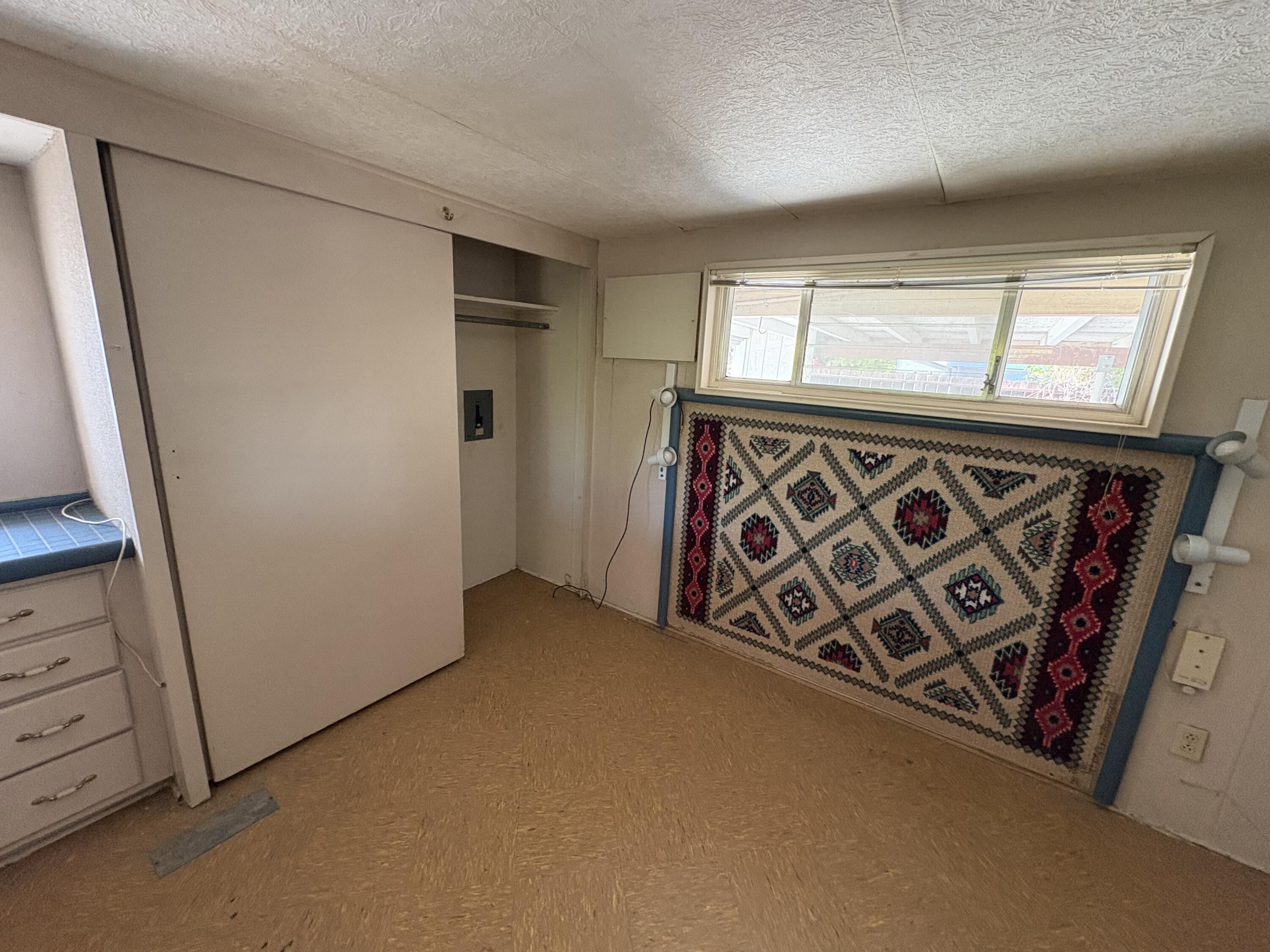 70260 Highway 111, Unit 148 Rancho Mirage, CA 92270 - Photo 20 of 36 a view of an empty room with cabinet door