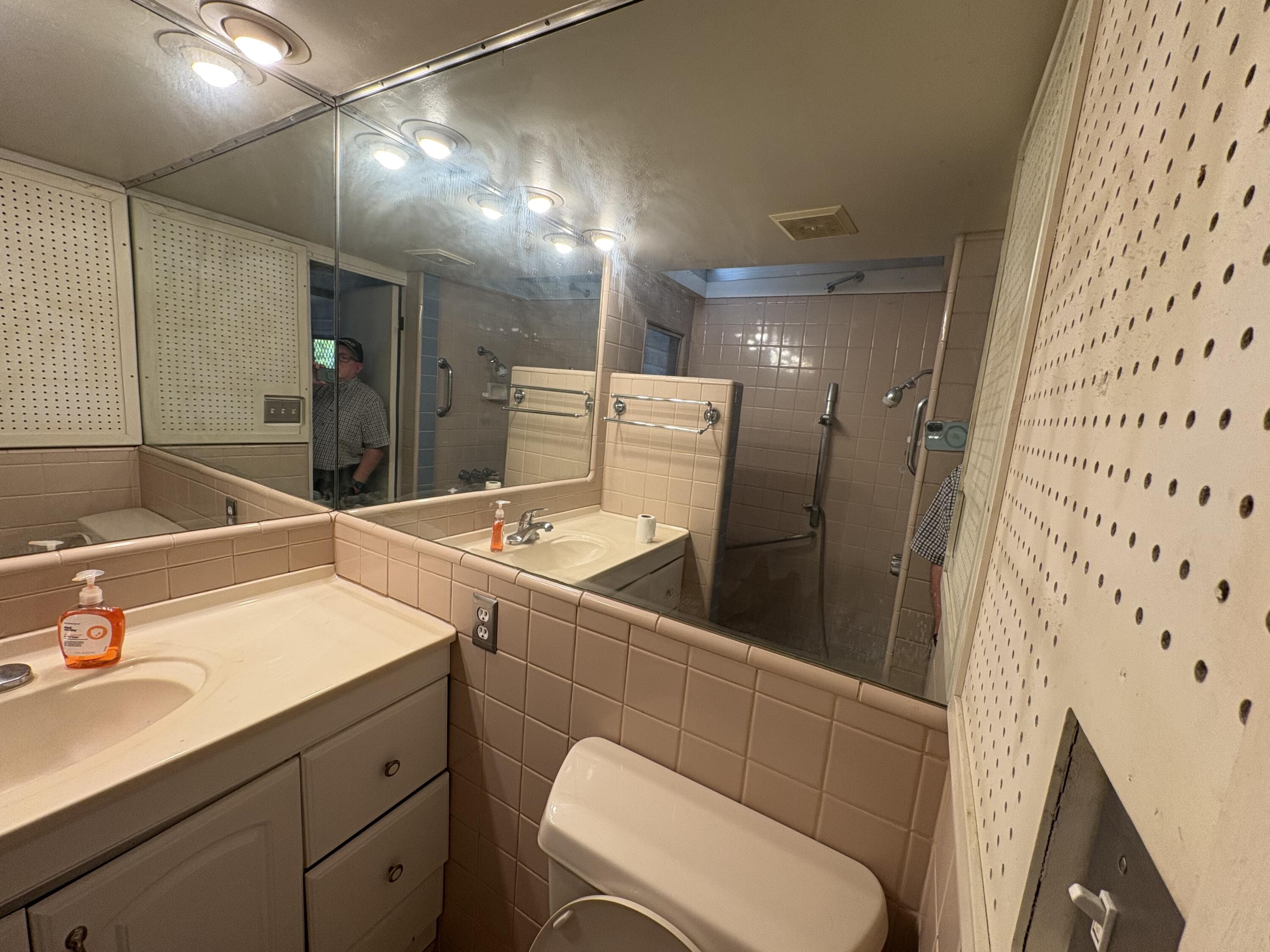 70260 Highway 111, Unit 148 Rancho Mirage, CA 92270 - Photo 22 of 36 a bathroom with a sink a toilet and mirror