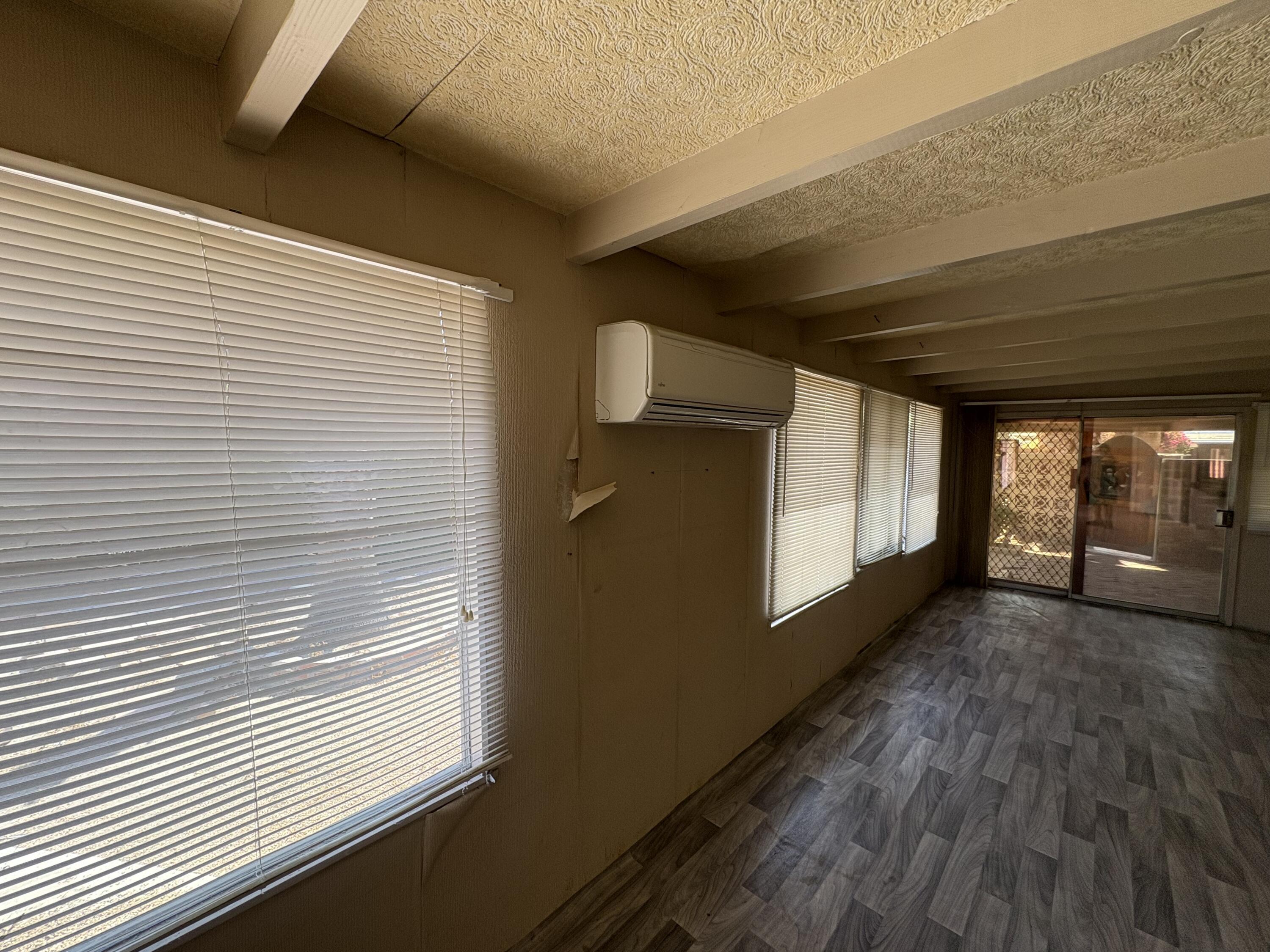70260 Highway 111, Unit 148 Rancho Mirage, CA 92270 - Photo 28 of 36 a view of a room with wooden floor and a window