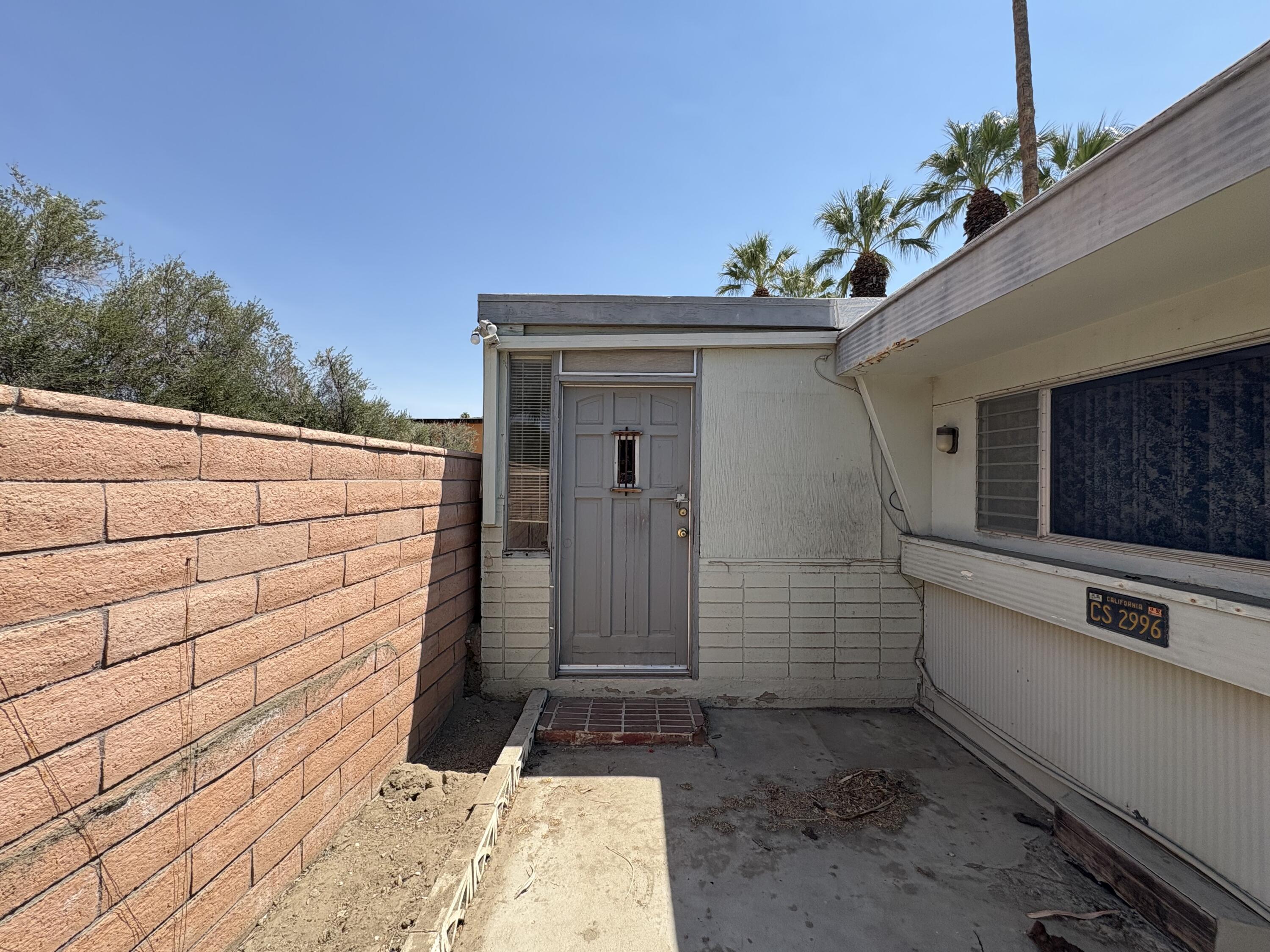 70260 Highway 111, Unit 148 Rancho Mirage, CA 92270 - Photo 32 of 36 a view of a entryway door of the house