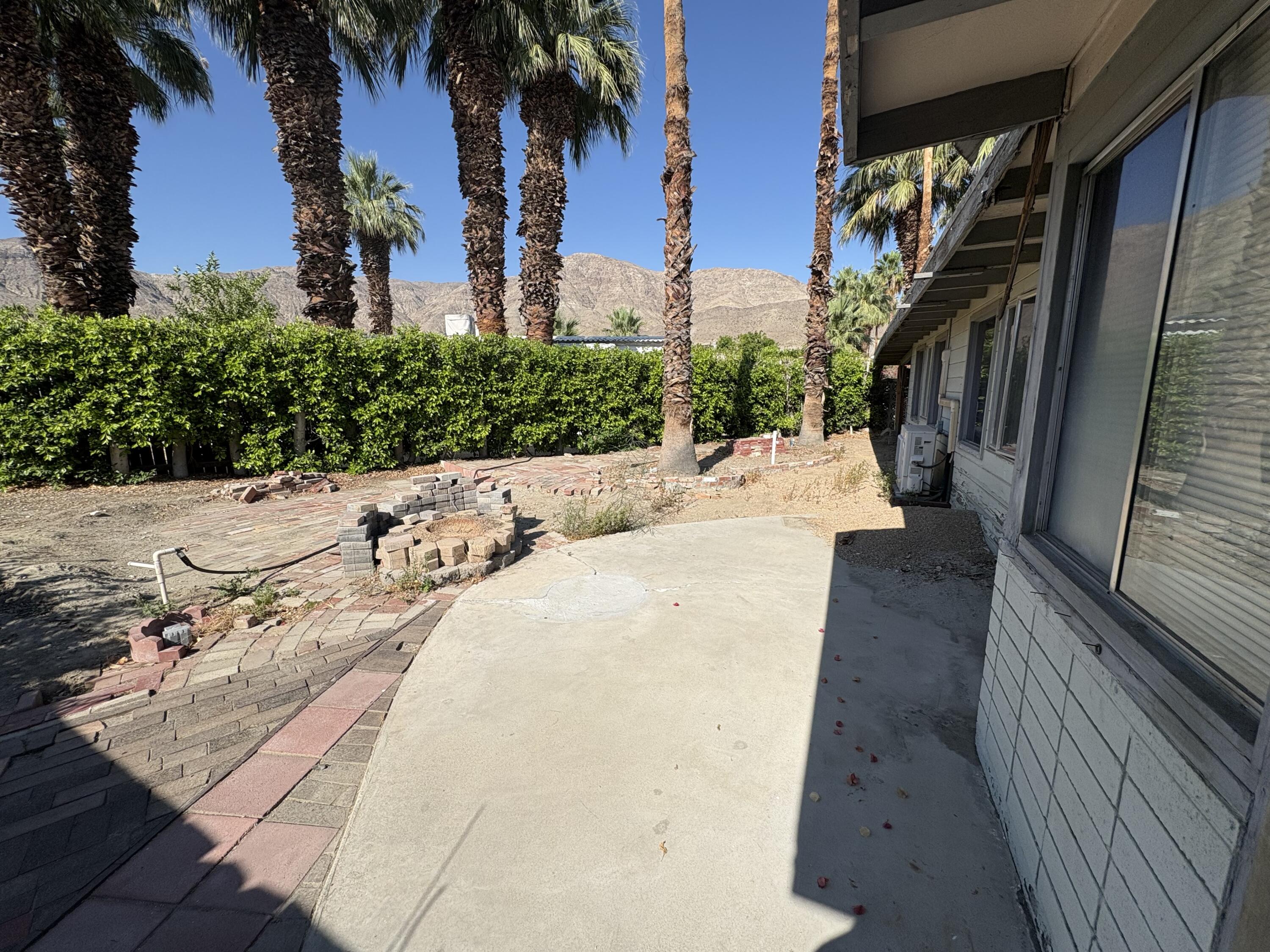 70260 Highway 111, Unit 148 Rancho Mirage, CA 92270 - Photo 4 of 36 a view of a backyard with a fountain