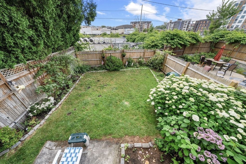 47 Middle Street, Unit 2 Boston, MA 02127 - Photo 11 of 13 a view of a chairs and table in a yard