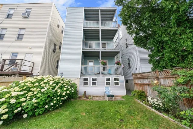 a front view of a building with parking space