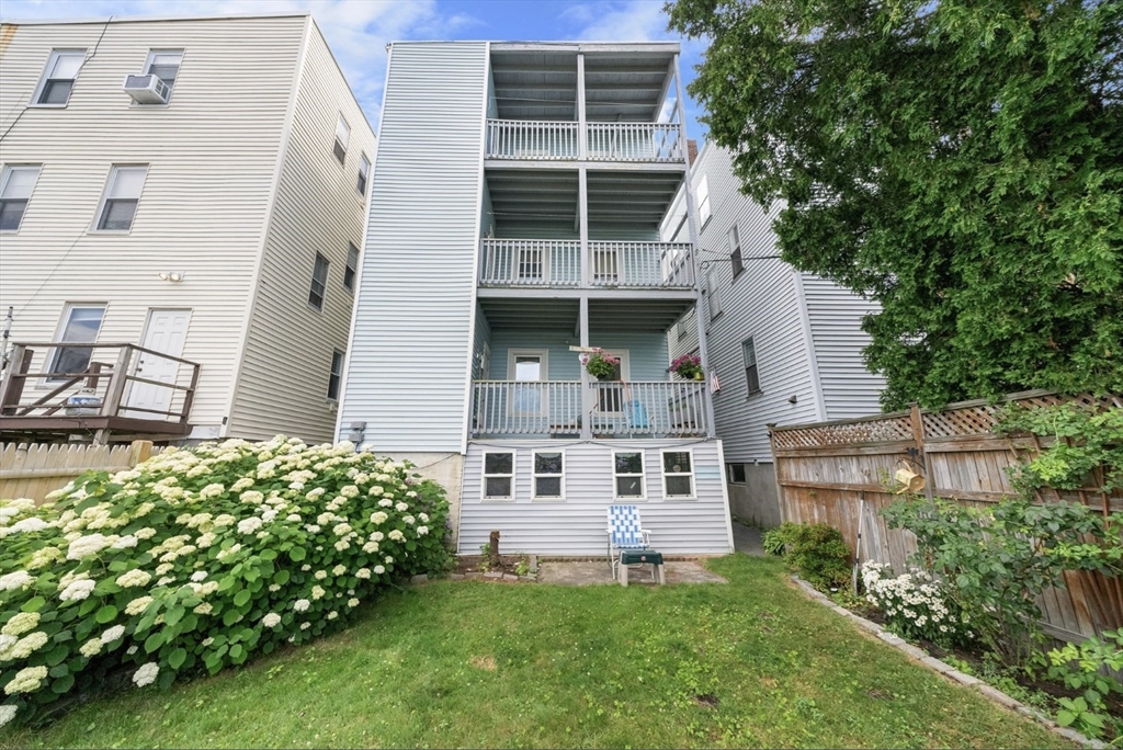 47 Middle Street, Unit 2 Boston, MA 02127 - Photo 12 of 13 front view of a house with a yard