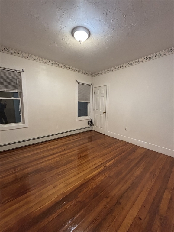 47 Middle Street, Unit 2 Boston, MA 02127 - Photo 3 of 13 a view of empty room with wooden floor