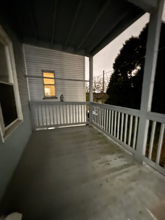47 Middle Street, Unit 2 Boston, MA 02127 - Photo 9 of 13 a view of balcony with wooden floor