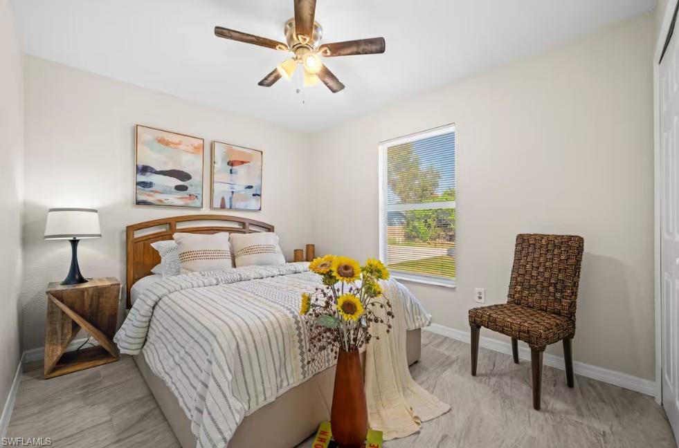 2715 Lee Street Punta Gorda, FL 33950 - Photo 24 of 50 a bedroom with a bed and a window