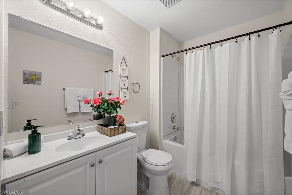 2715 Lee Street Punta Gorda, FL 33950 - Photo 31 of 50 a bathroom with a sink a toilet and a mirror