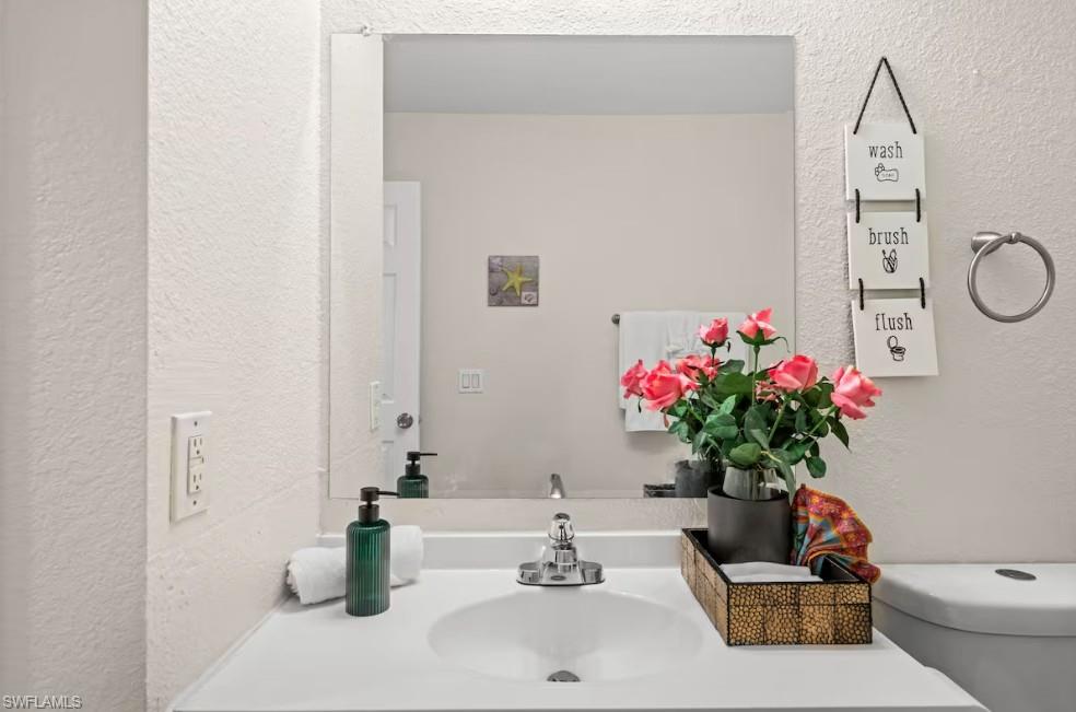 2715 Lee Street Punta Gorda, FL 33950 - Photo 32 of 50 a bathroom with a sink a vanity and a potted plant