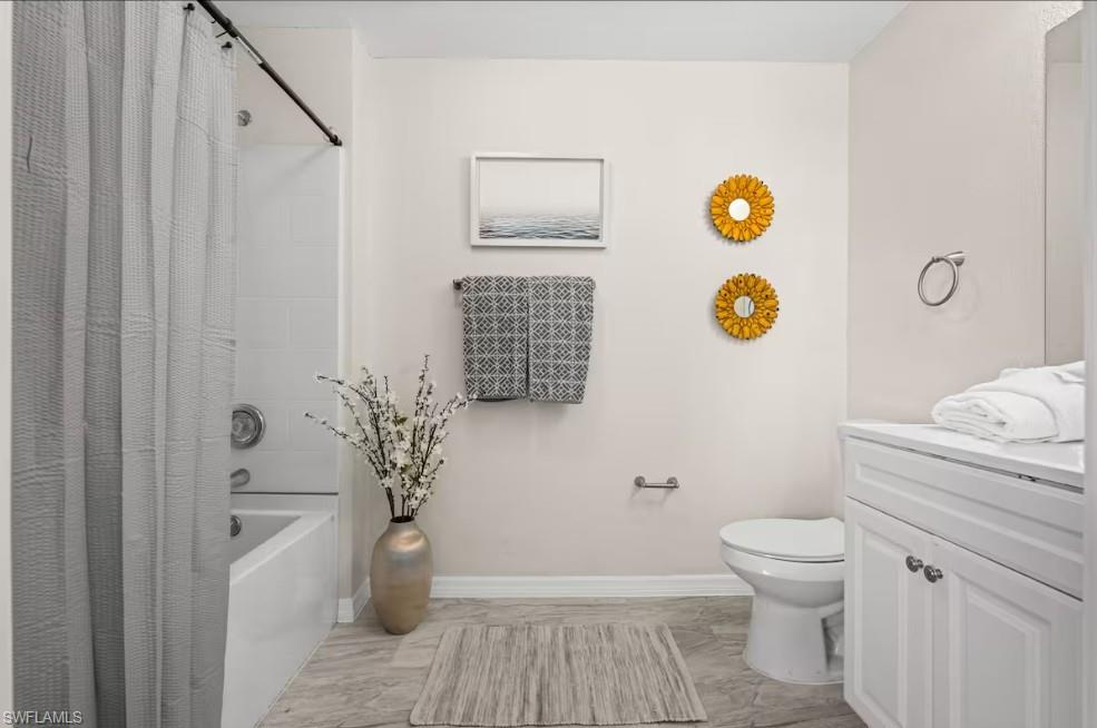 2715 Lee Street Punta Gorda, FL 33950 - Photo 34 of 50 a bathroom with a granite countertop toilet and a shower