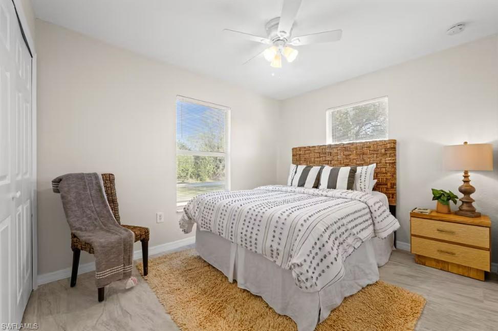 2715 Lee Street Punta Gorda, FL 33950 - Photo 40 of 50 a bedroom with a bed a chair and a couch
