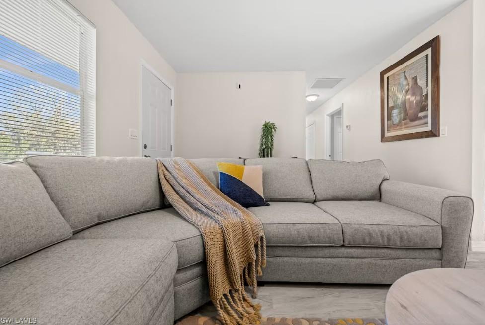 2715 Lee Street Punta Gorda, FL 33950 - Photo 7 of 50 a living room with a couch
