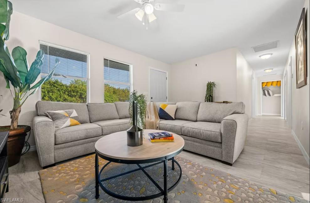 2715 Lee Street Punta Gorda, FL 33950 - Photo 8 of 50 a living room with furniture and a potted plant
