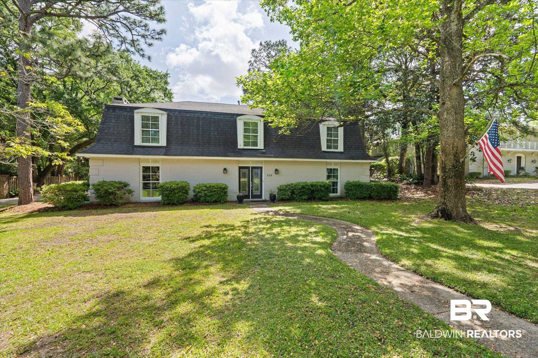 559 East Cumberland Road Mobile, AL 36608 - Photo 43 of 48 View of front of house with roof with shingles, a front lawn, and brick siding