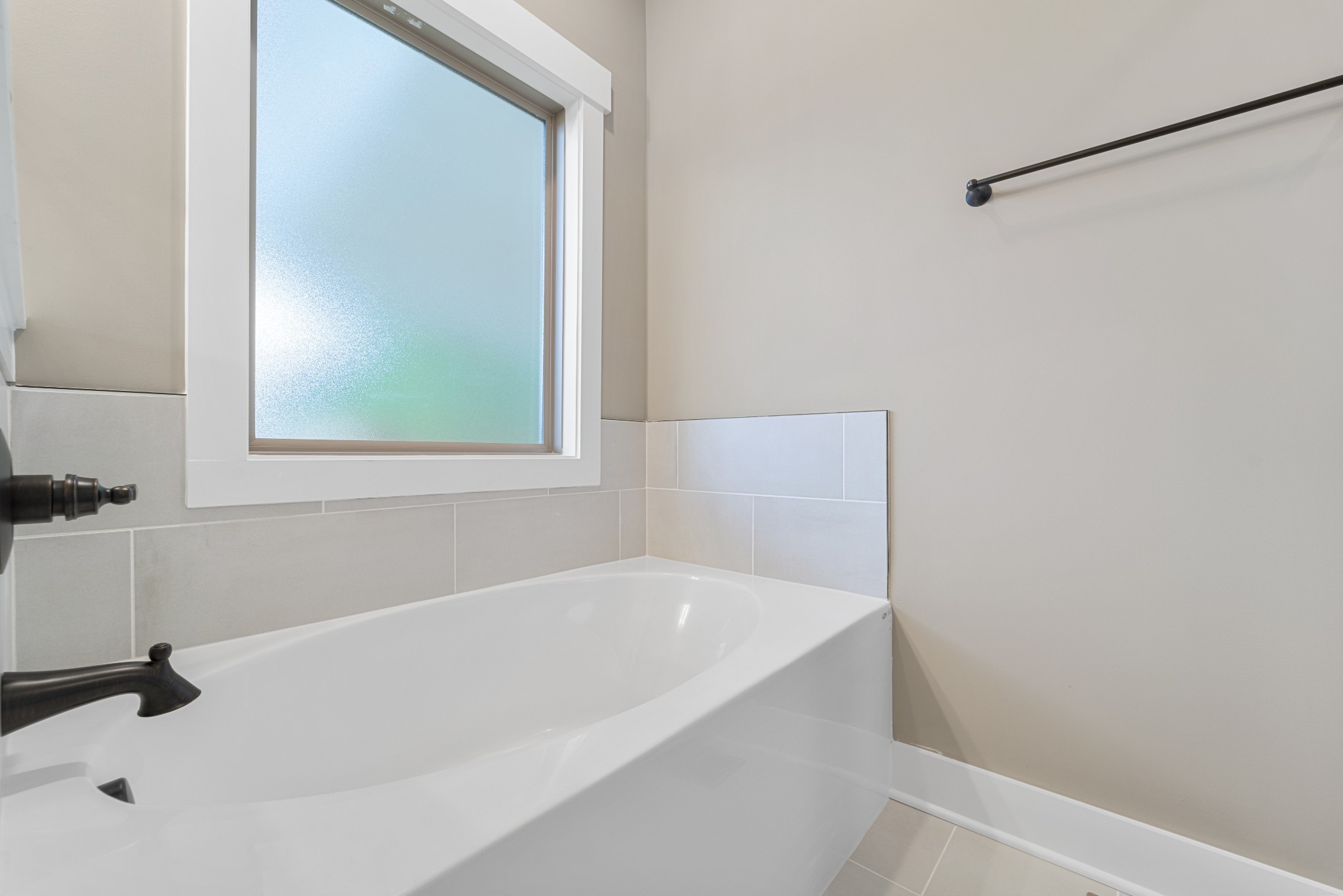 5751 Lakeview Road Springfield, TN 37172 - Photo 18 of 28 a white bath tub sitting next to a window