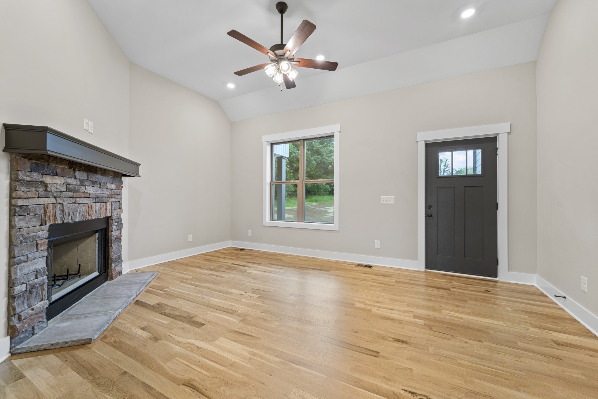 5751 Lakeview Road Springfield, TN 37172 - Photo 6 of 28 a view of an empty room with chandelier fan and fire place