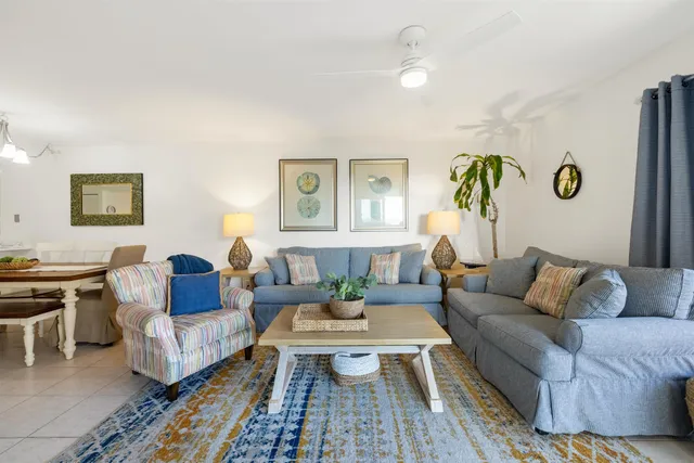 a living room with furniture rug and window