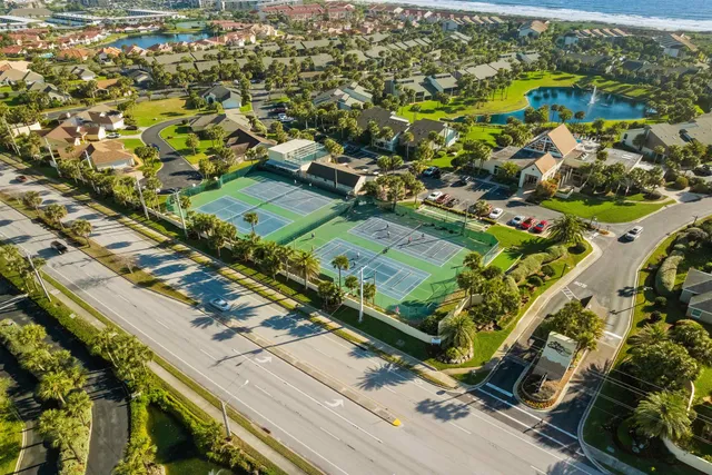 an aerial view of residential houses with outdoor space