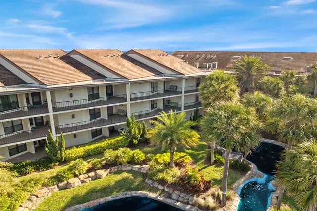 a view of a large building with a yard