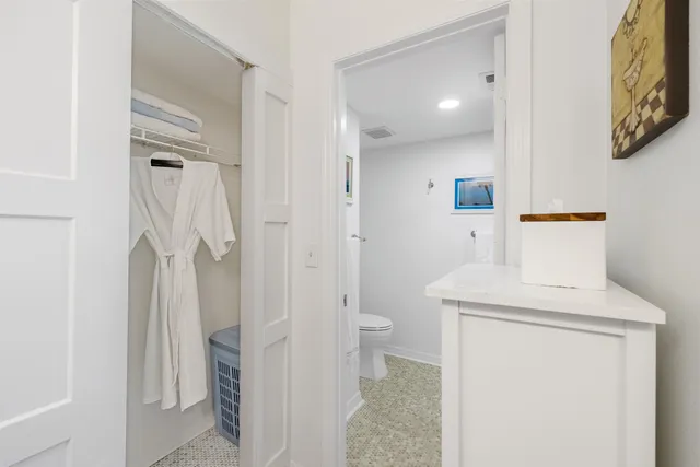 a bathroom with a toilet sink and shower