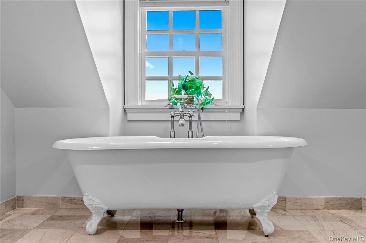 245 River Road Nyack, NY 10960 - Photo 35 of 45 Full bathroom with vaulted ceiling and a freestanding tub
