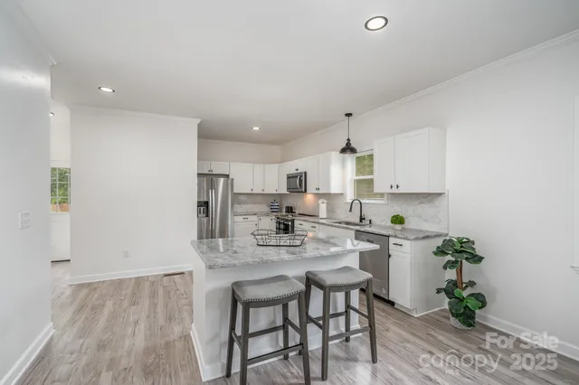a bedroom with a bed and a ceiling fan