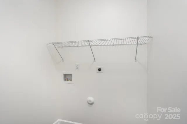 a bedroom with a bed and a ceiling fan