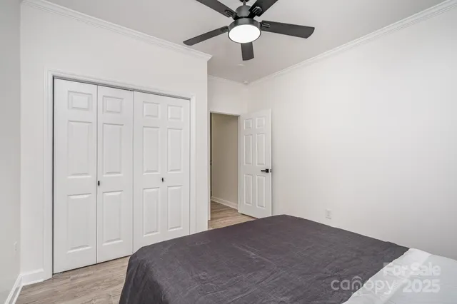 an aerial view of a house with a garden and lake view