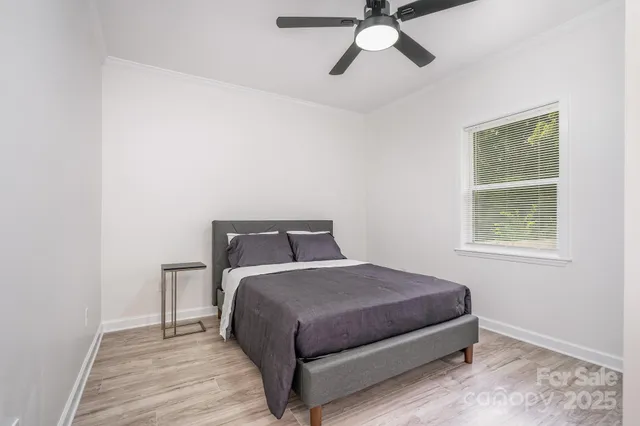 an aerial view of residential houses with city view