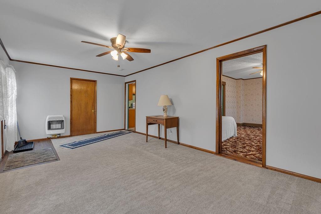 1196 Mercer Road Ellwood City, PA 16117 - Photo 11 of 31 a living room with furniture and a chandelier