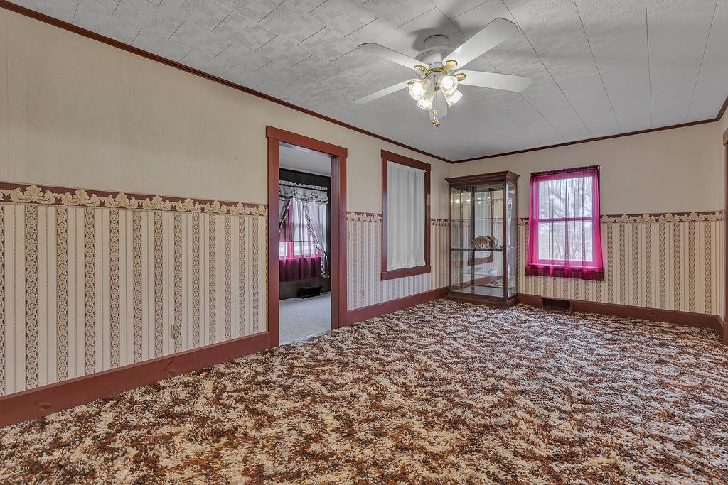 1196 Mercer Road Ellwood City, PA 16117 - Photo 17 of 31 a view of a livingroom with a ceiling fan
