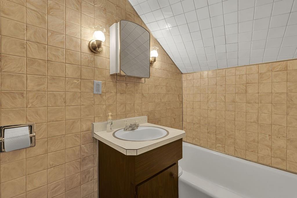 1196 Mercer Road Ellwood City, PA 16117 - Photo 20 of 31 a bathroom with a sink and mirror