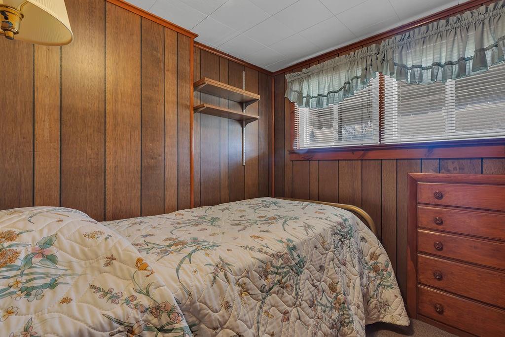 1196 Mercer Road Ellwood City, PA 16117 - Photo 23 of 31 a bedroom with a bed and a dresser