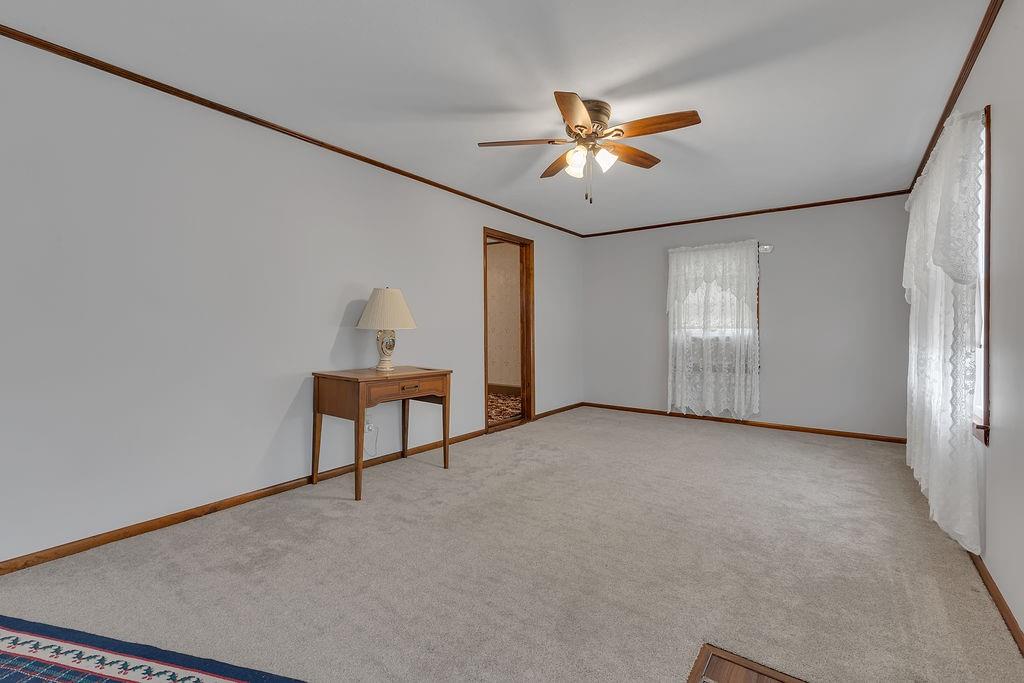 1196 Mercer Road Ellwood City, PA 16117 - Photo 10 of 31 an empty room with windows and fan