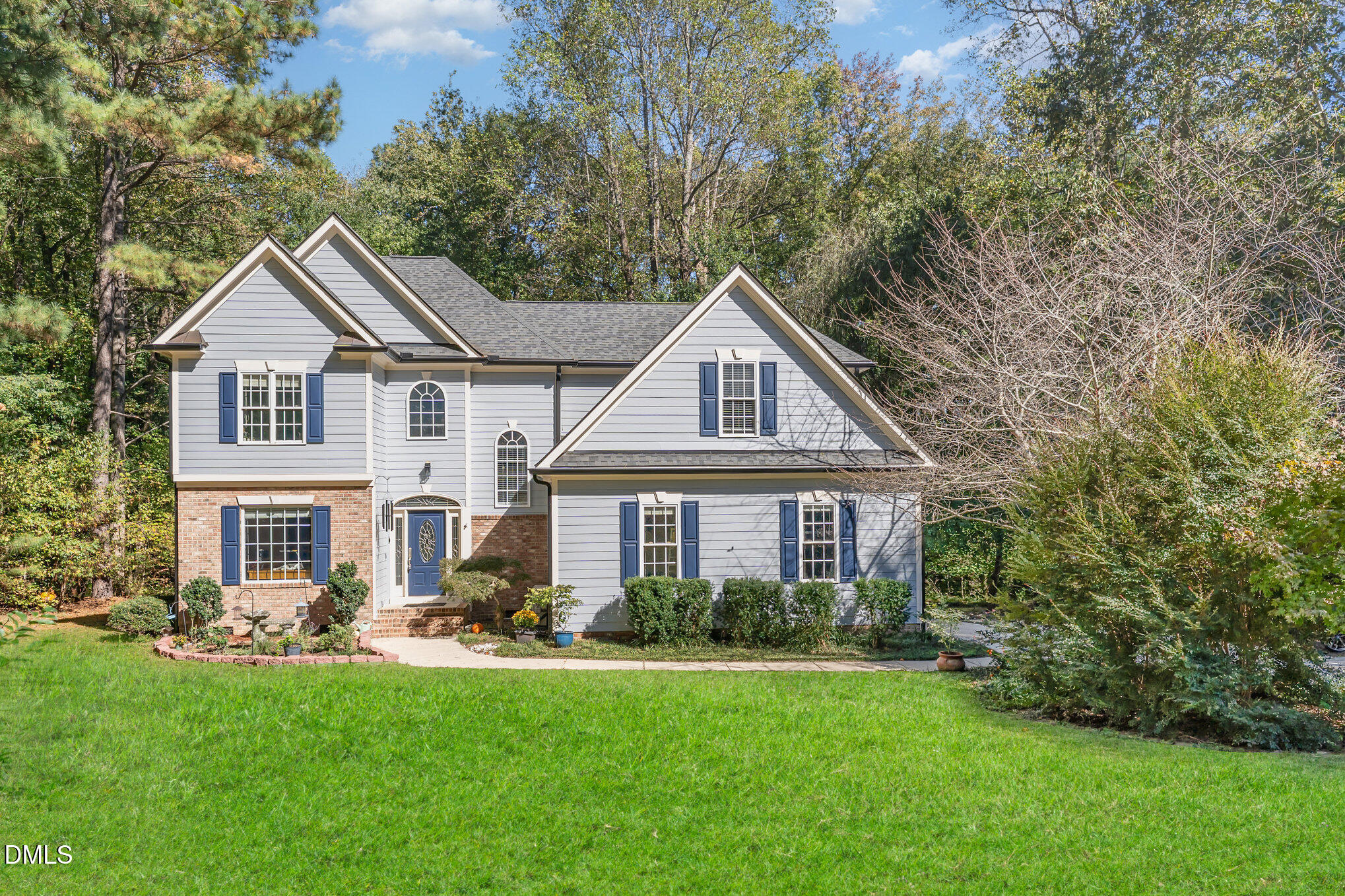 4613 Cherrybark Lane Raleigh, NC 27616 - Photo 26 of 27 a front view of a house with a yard and trees
