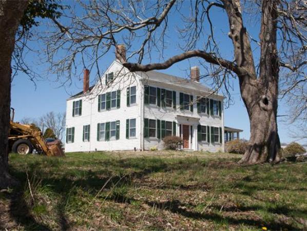 875 A Horseneck Road Westport, MA 02790 - Photo 1 of 30 a front view of a house with a garden