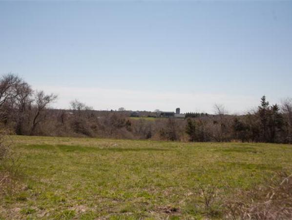 875 A Horseneck Road Westport, MA 02790 - Photo 16 of 30 a view of a field with trees in the background