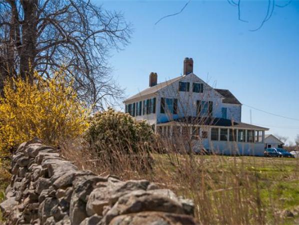 875 A Horseneck Road Westport, MA 02790 - Photo 2 of 30 a front view of a house with a yard