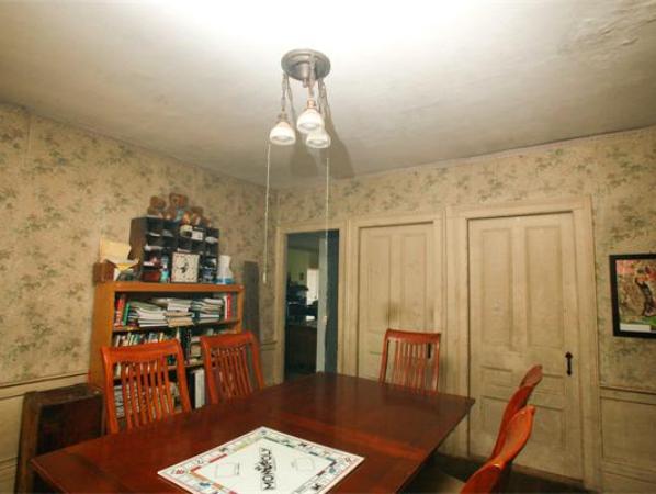 875 A Horseneck Road Westport, MA 02790 - Photo 21 of 30 a dining room with furniture and wooden floor