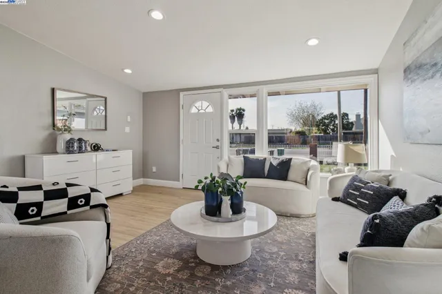 a living room with furniture and a large window