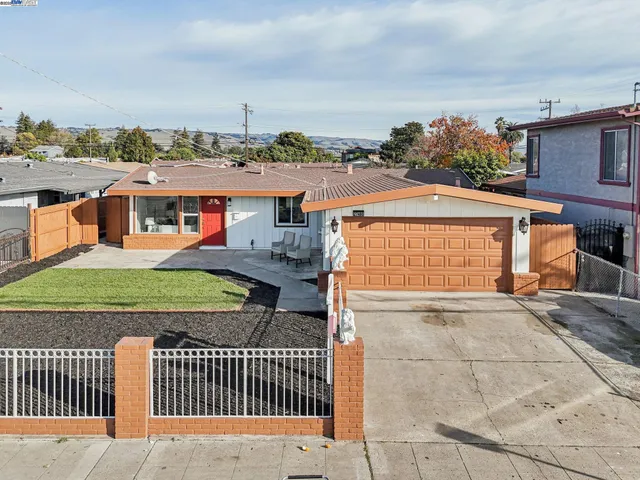 a balcony with next to a yard
