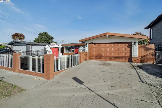 a front view of a house with garage