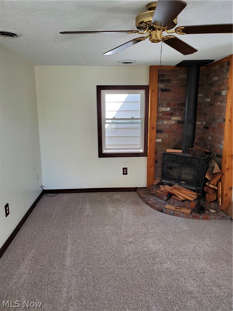 6640 Swetland Road Madison, OH 44057 - Photo 7 of 19 Wood burning stove in family room