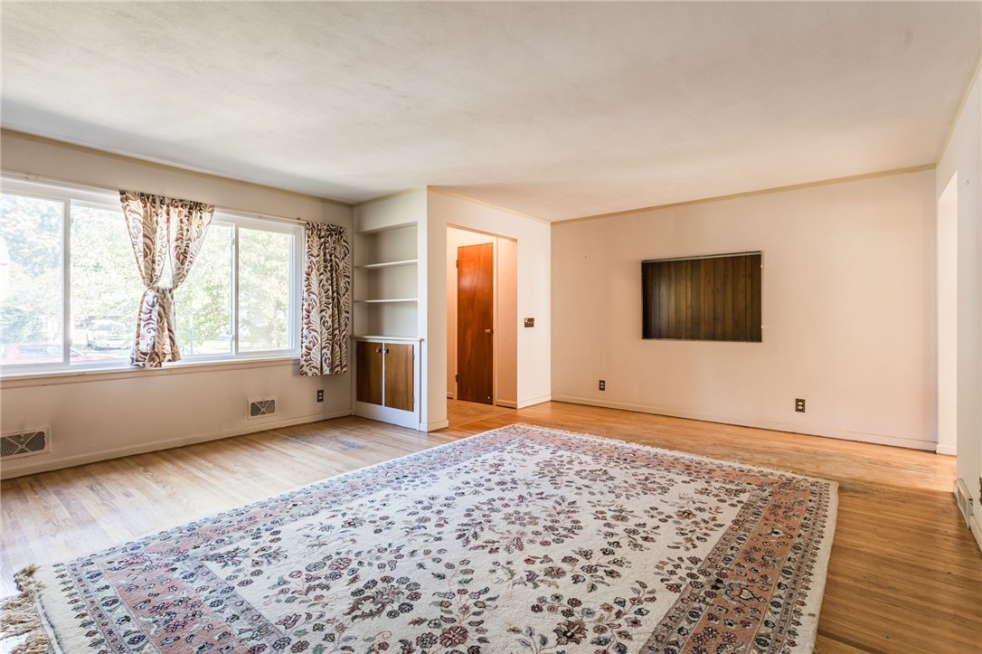 27 Angora Drive Irondequoit, NY 14617 - Photo 4 of 19 Wall of windows lets in great natural light!